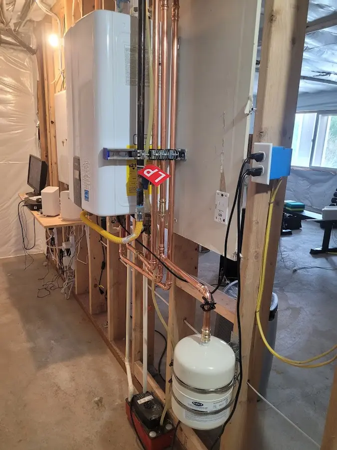Licensed plumber repairing a kitchen sink in Sherman
